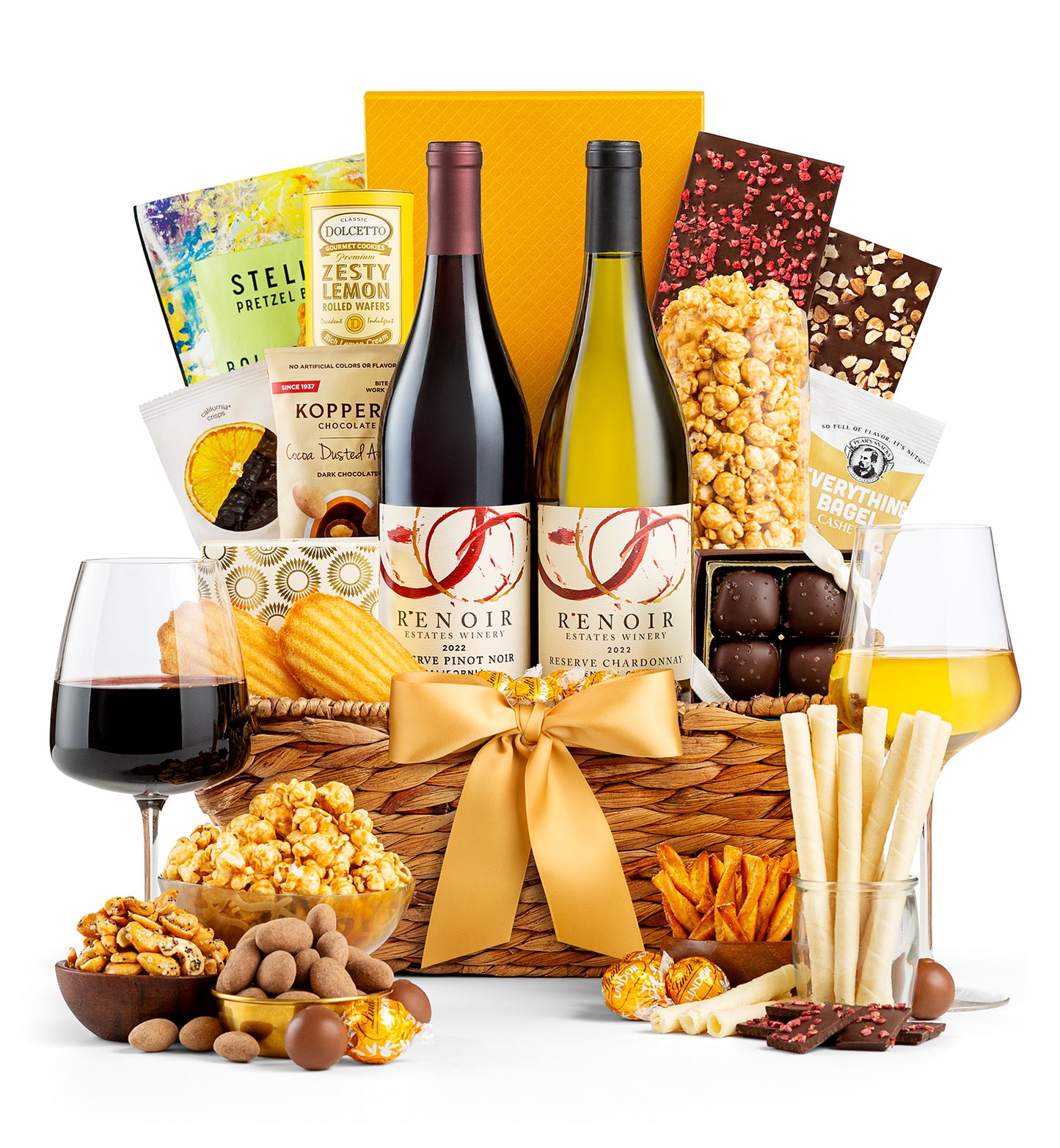 Wine gift basket with Renoir wine bottles, snacks, and glasses on a white background