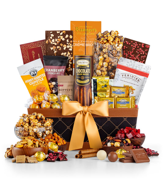 Gourmet gift basket with various snacks and chocolates on a white background