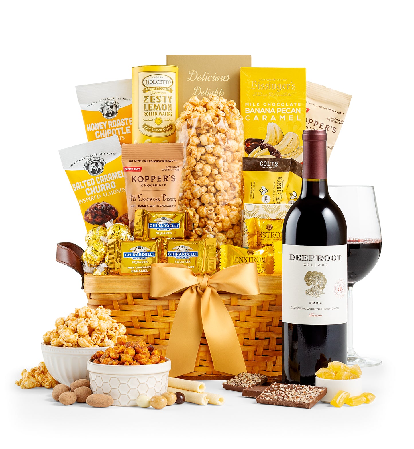 Gourmet gift basket with snacks, a bottle of DeepRoot wine, on a white background