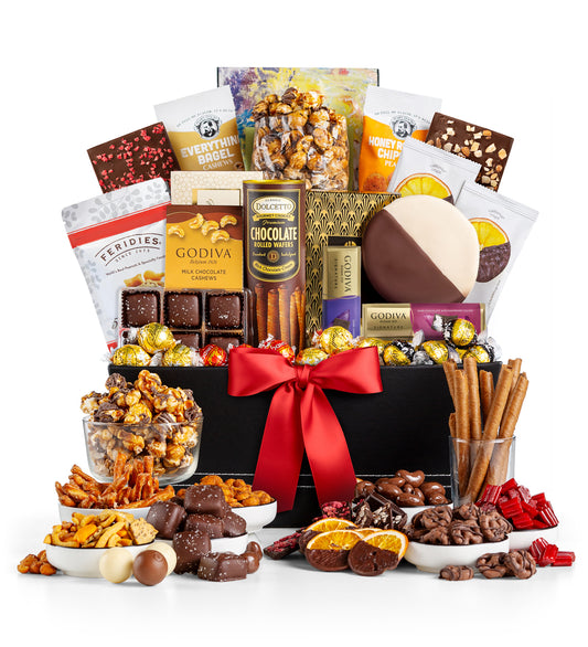Manhattan gourmet gift basket with indulgent chocolates, pretzels, and other snacks on a white background
