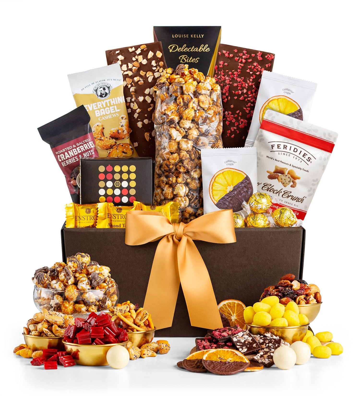 Gourmet gift basket with a variety of snacks and candies on a white background