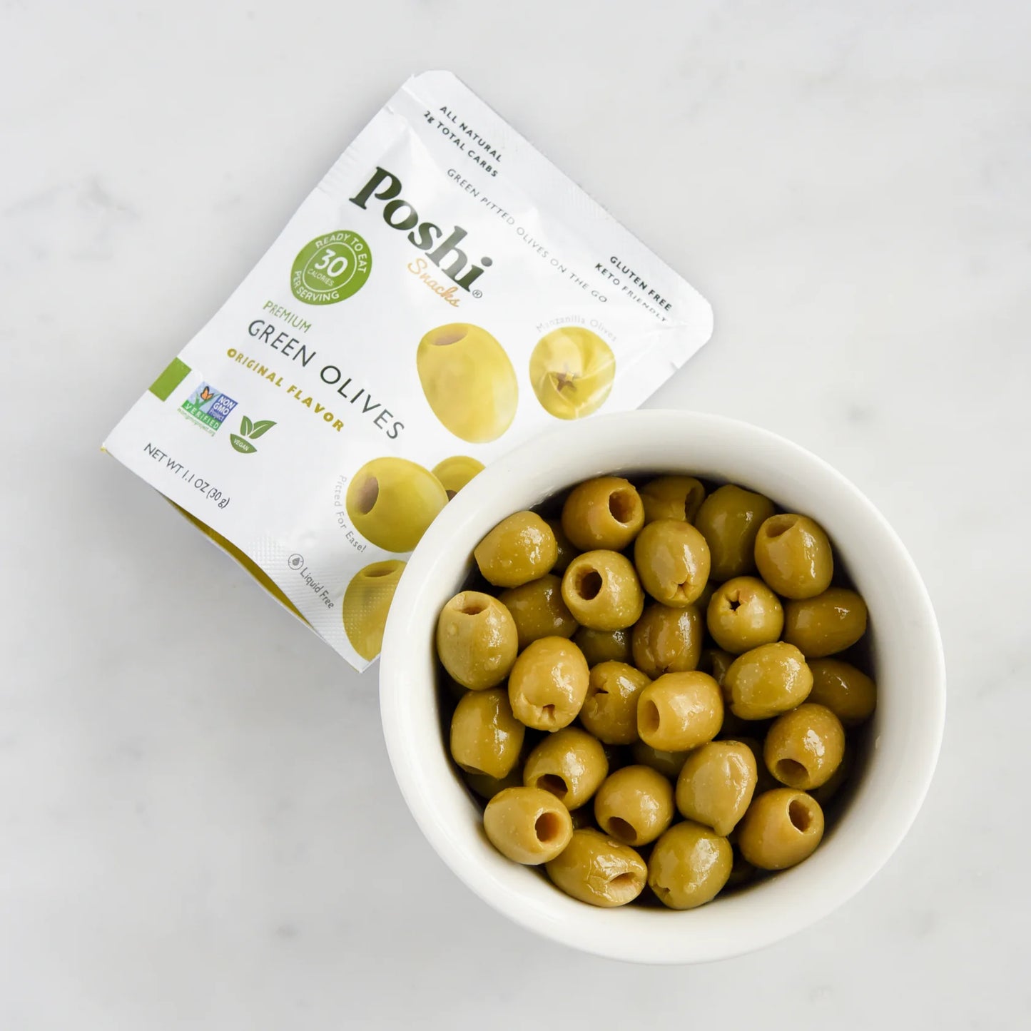 Poshi green olives packaging with a bowl of olives on a white background
