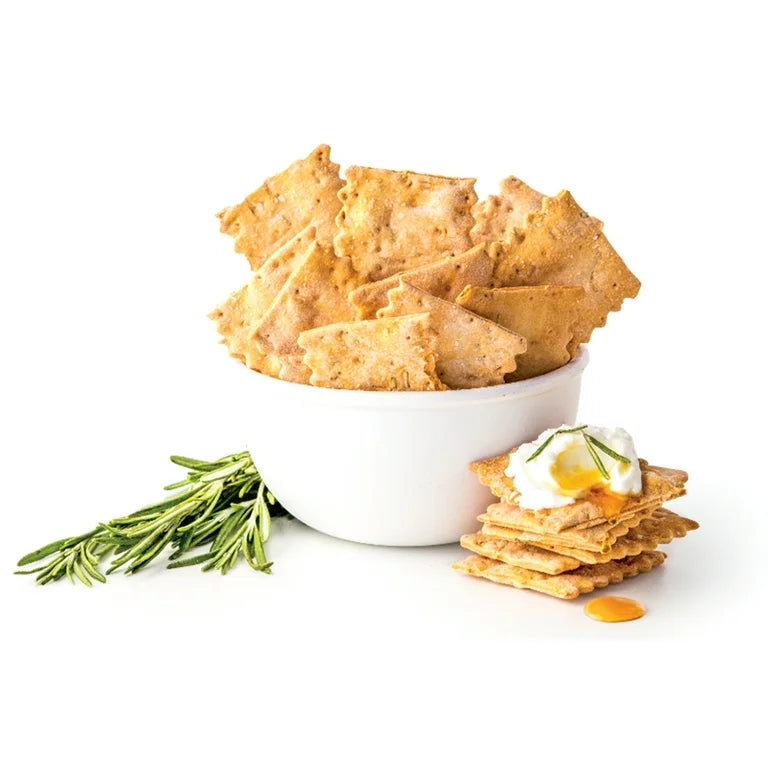Bowl of rustic flatbreads on a white background.