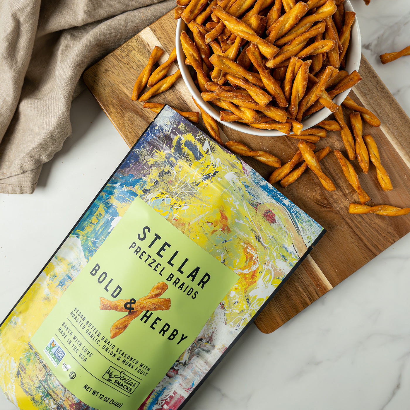 Stellar Pretzel Breads packaging with pretzels on a wooden board