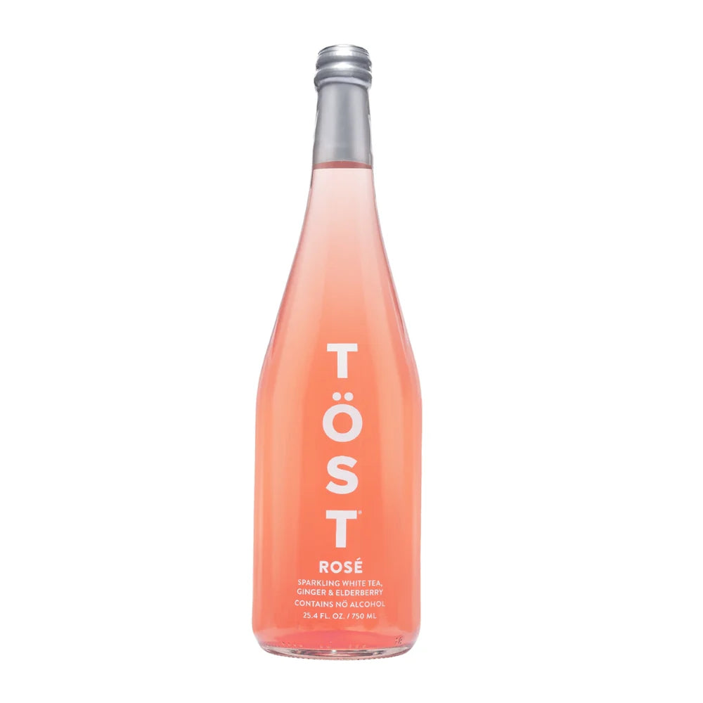 Bottle of Töst Rosé sparkling wine on a white background