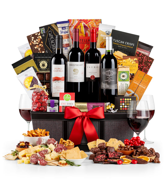 Regal Wine and gourmet gift basket with wine, snacks, and fruits on a white background