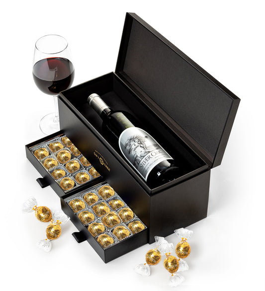 Silver Oak Alexander Valley with gold chocolates in a black box on a white background