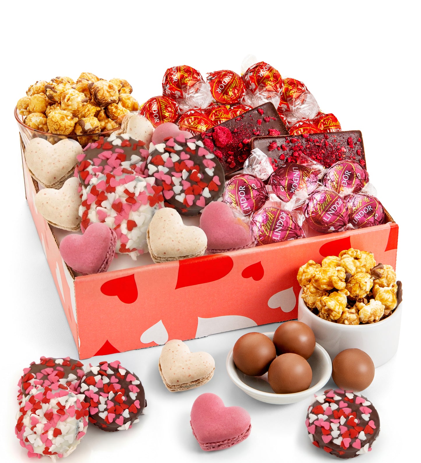Assorted candy and snack box with heart-themed packaging on a white background
