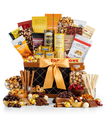 Gourmet gift basket with various snacks and treats on a white background