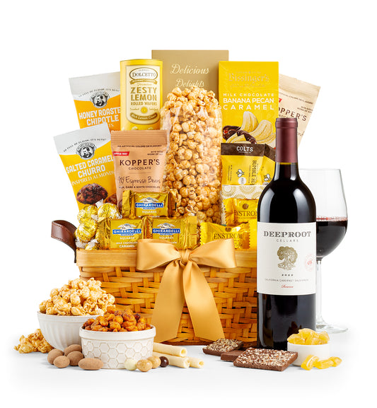 Gourmet gift basket with snacks, a bottle of  DeepRoot wine, on a white background