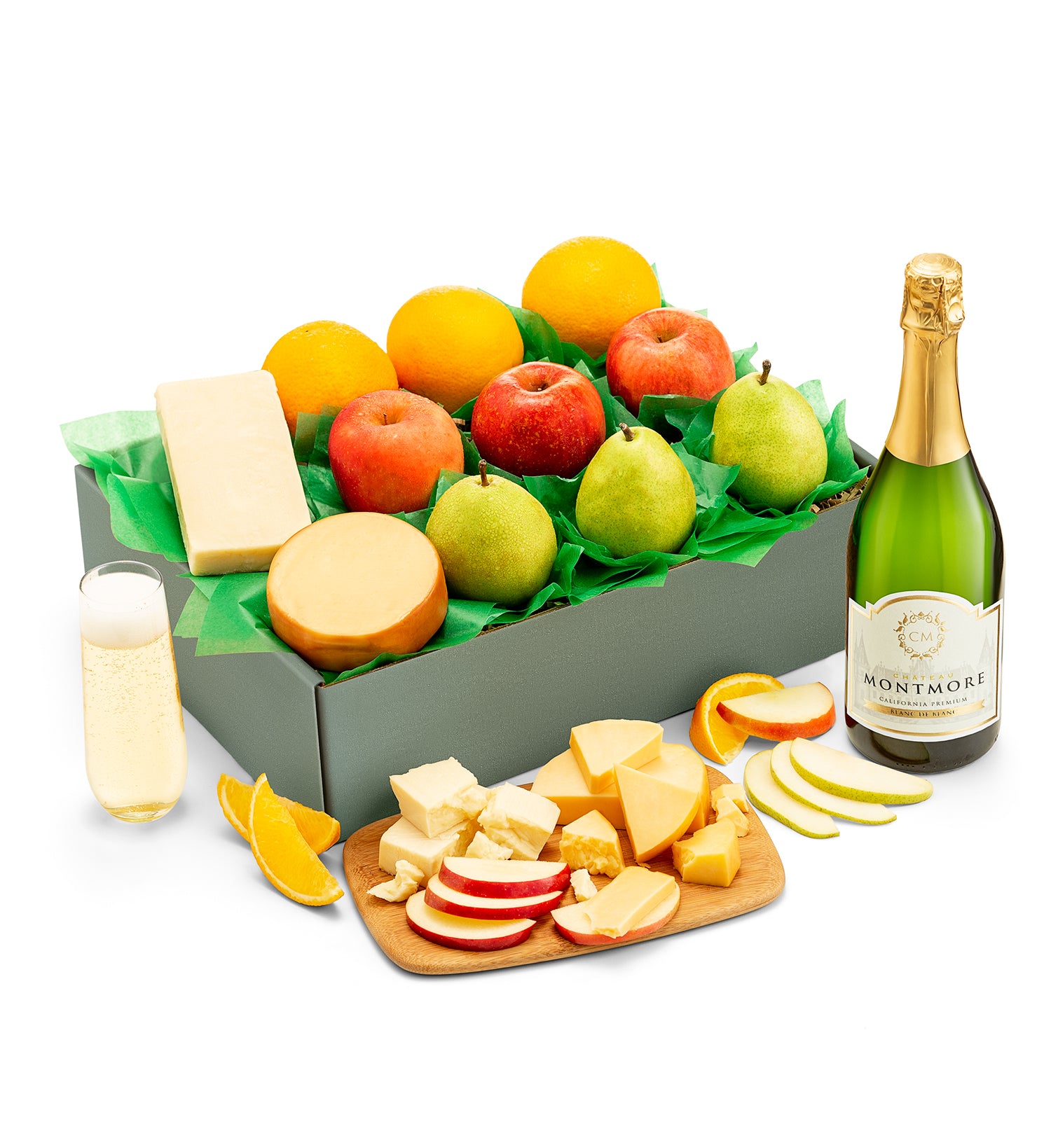 Fruit and cheese box with a bottle of chateau montmore sparkling on a white background