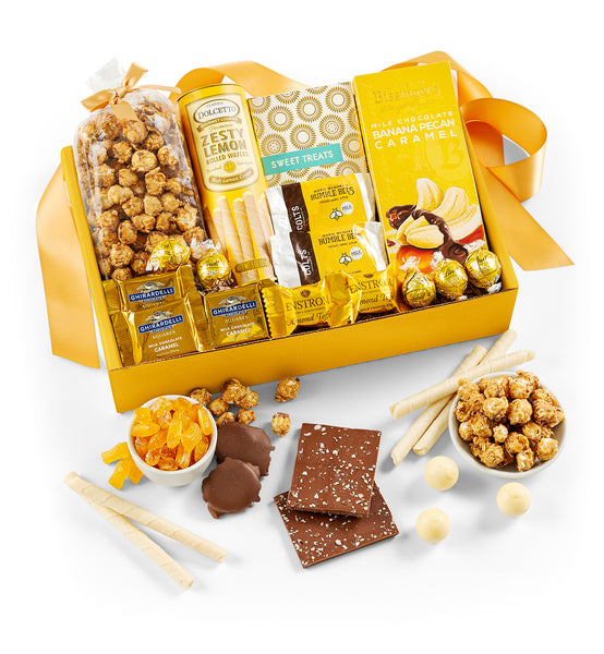 Gourmet gift box with snacks and chocolate on a white background