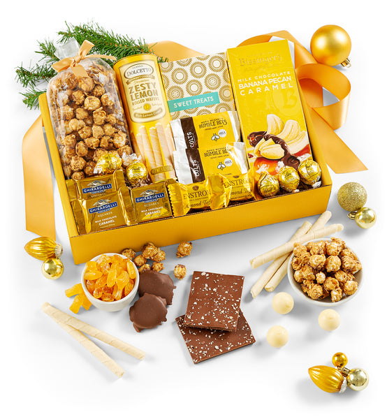 Gourmet gift box and holiday decoration with snacks and treats on a white background.