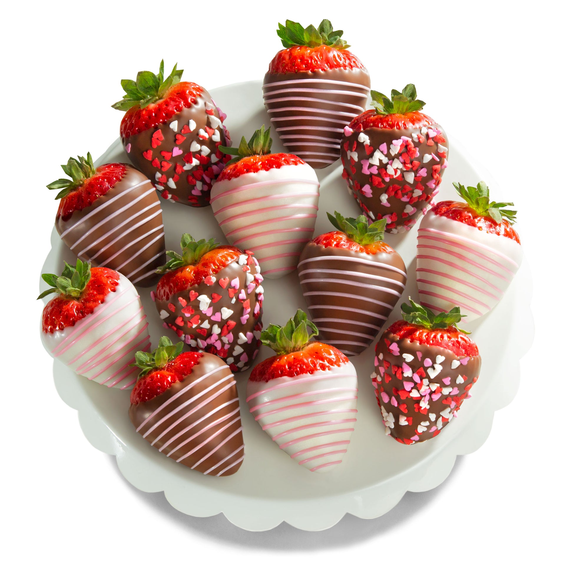 Assorted chocolate-dipped strawberries on a white plate