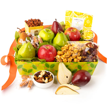 Gourmet fruit and snack gift basket with apples, pears, and nuts on a white background