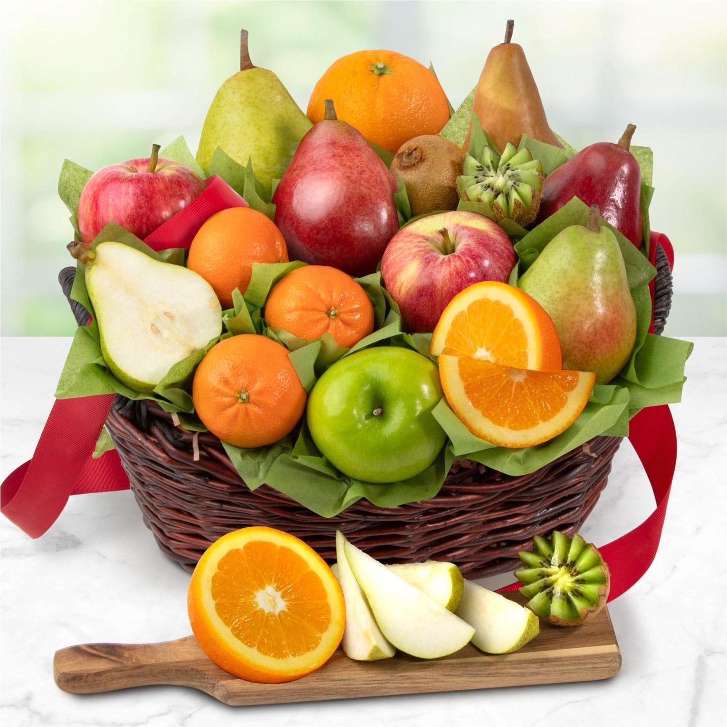 Basket of assorted fruits including apples, oranges, pears, and kiwis on a white background.