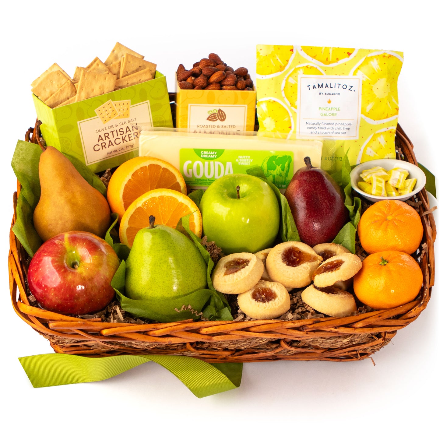 Fruit and snack basket with apples, oranges, pears, and cookies on a white background