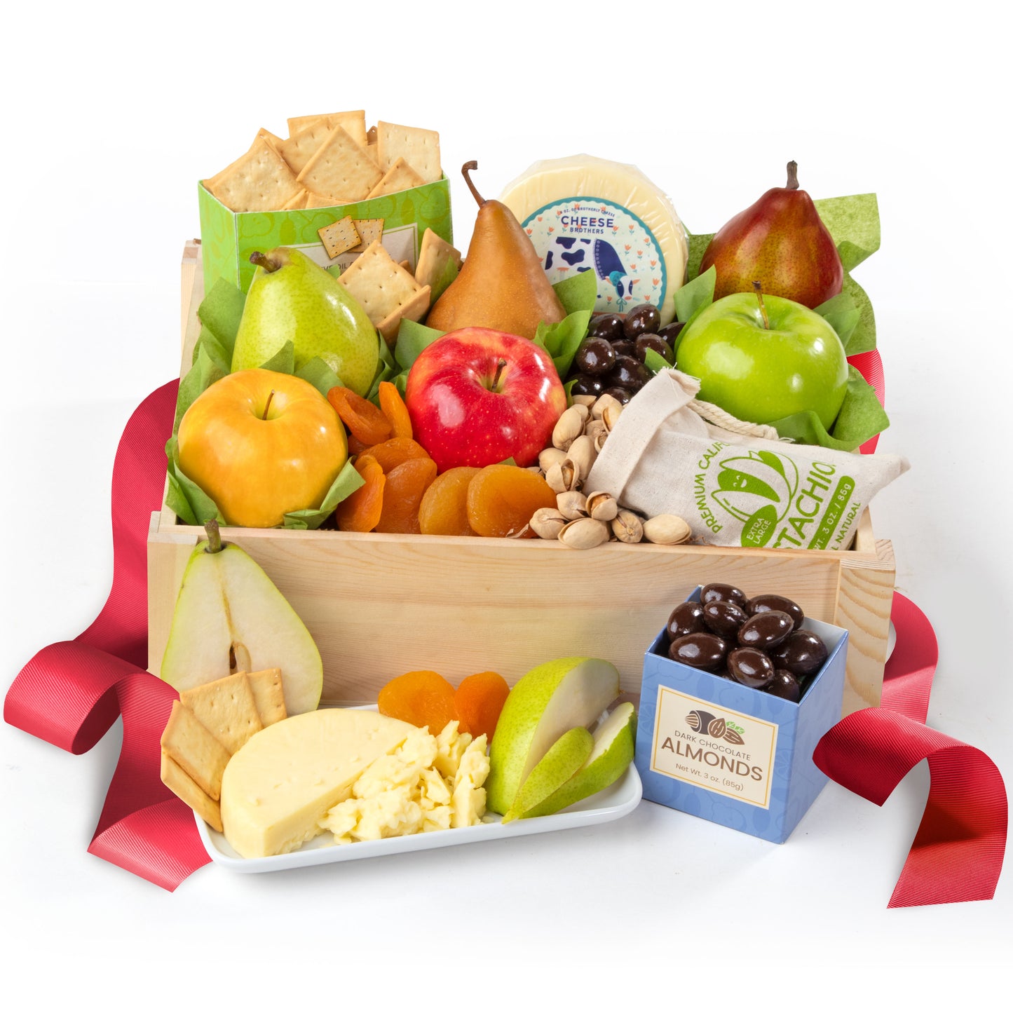 Gourmet gift basket with fruits, cheese, and nuts on a white background