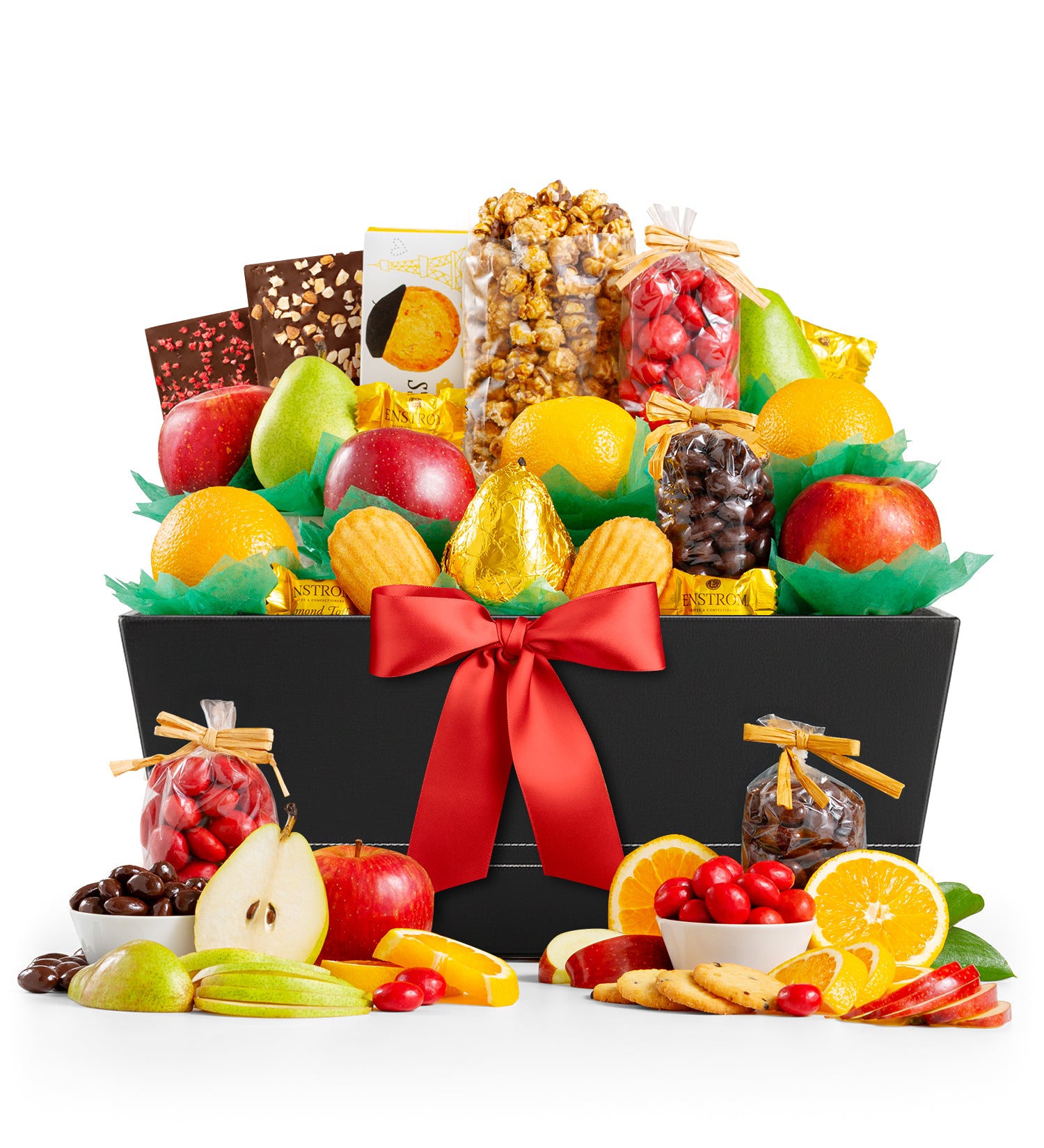 Fruit and snack gift basket with a red ribbon on a white background