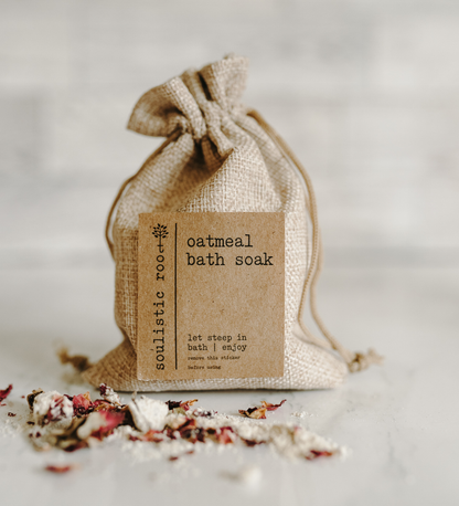 Burlap bag with 'Oatmeal bath soak' label on a light background